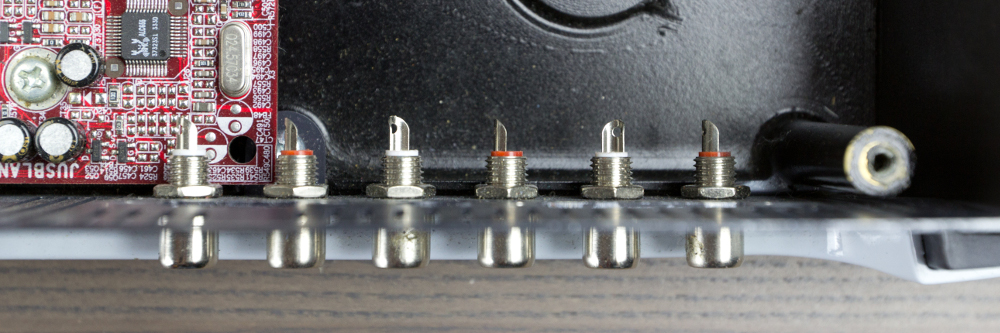 An overhead view of the unconnected surround sound audio RCA connectors.